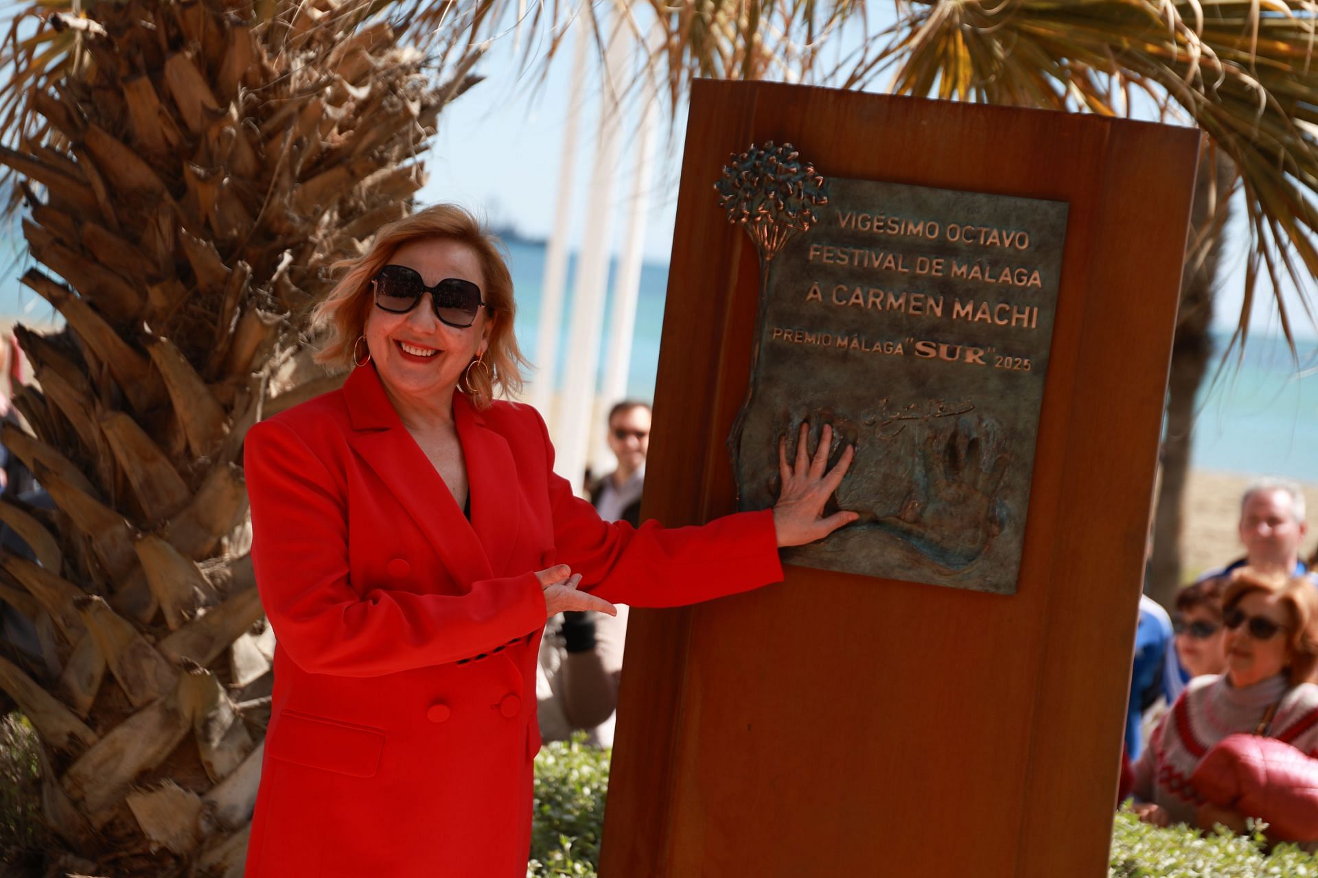 Carmen Machi poses next to a monolith in her honour after she was awarded the Malaga-SUR award during the 28th Malaga Film Festival on March 15, 2025 in Malaga, Spain. (Image via Getty)